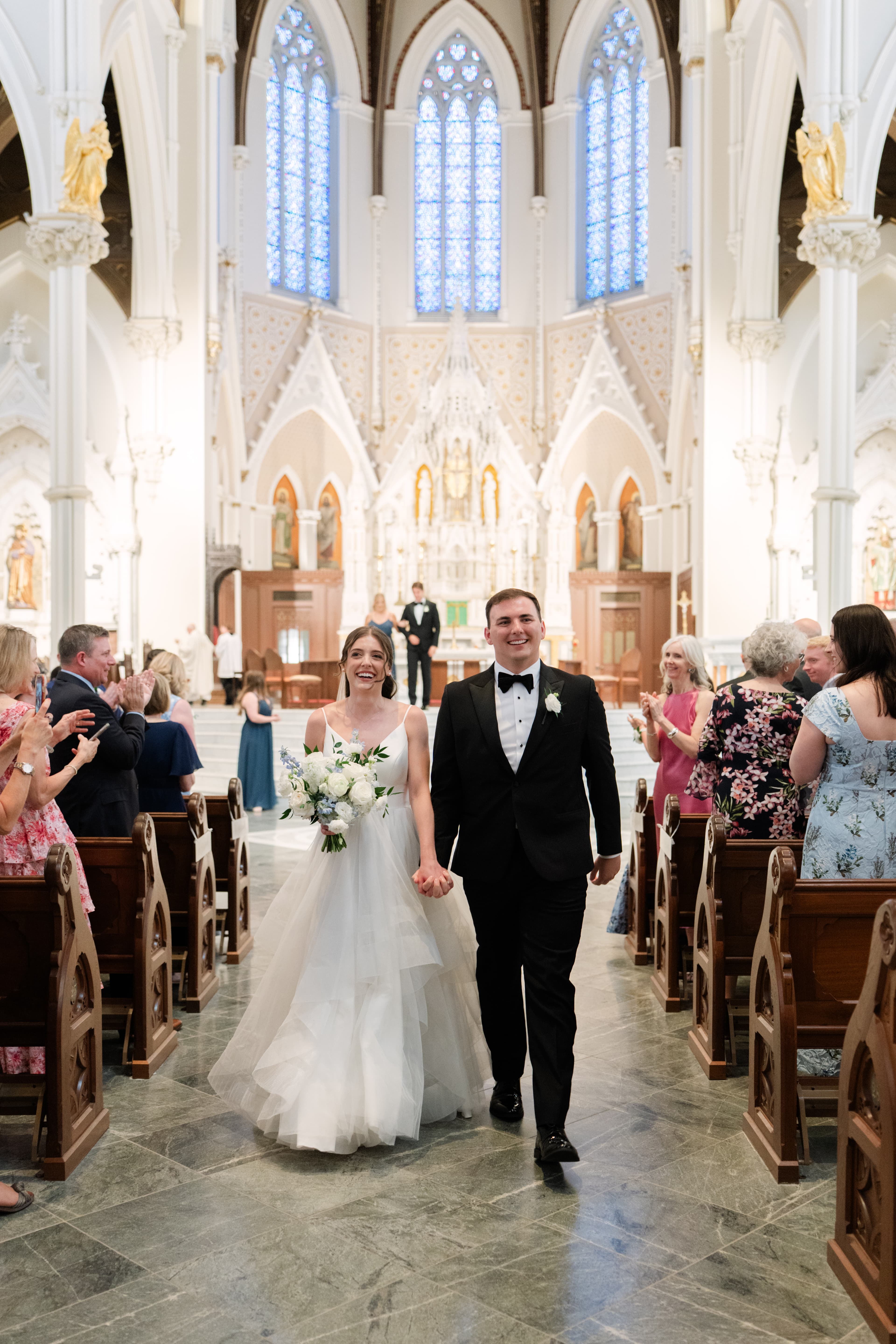 A couple during their wedding ceremony, photographed by Andrew Kusakin