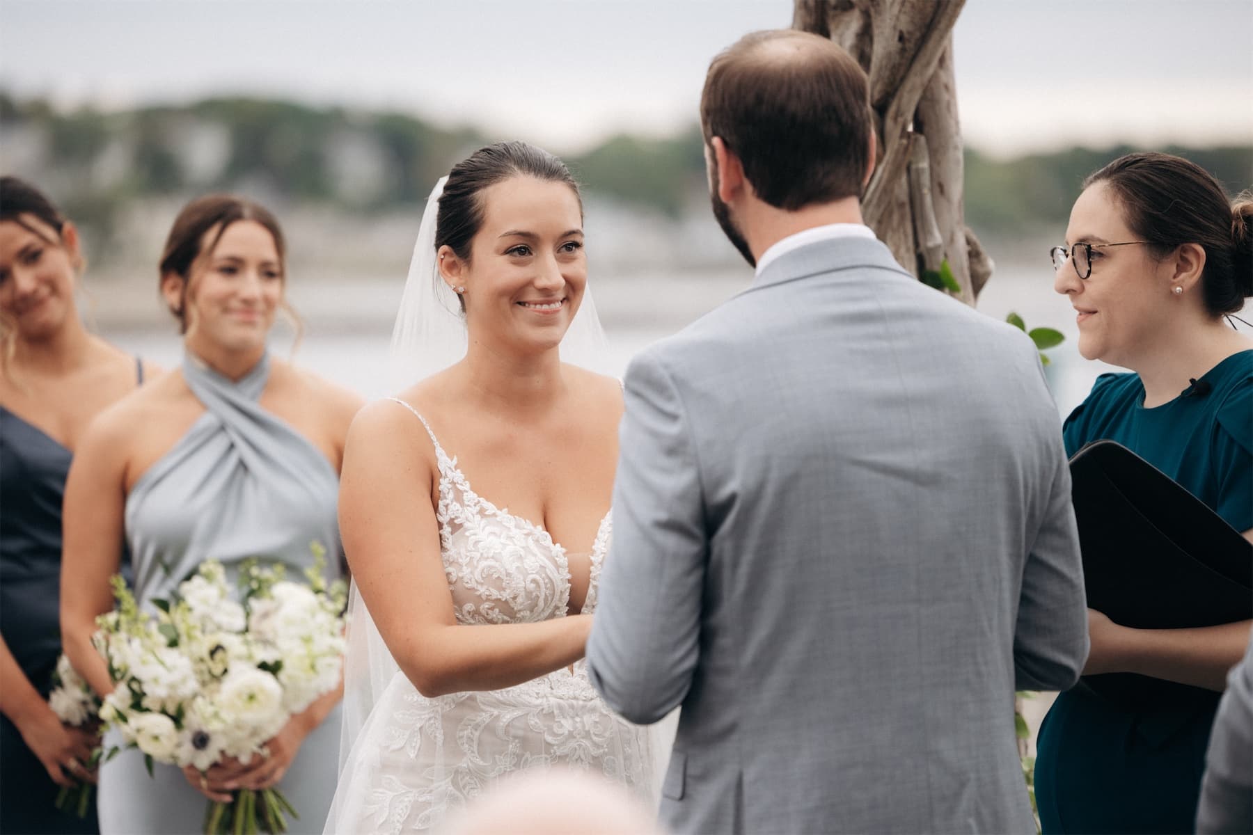 A bride smiling at her groom during their wedding ceremony